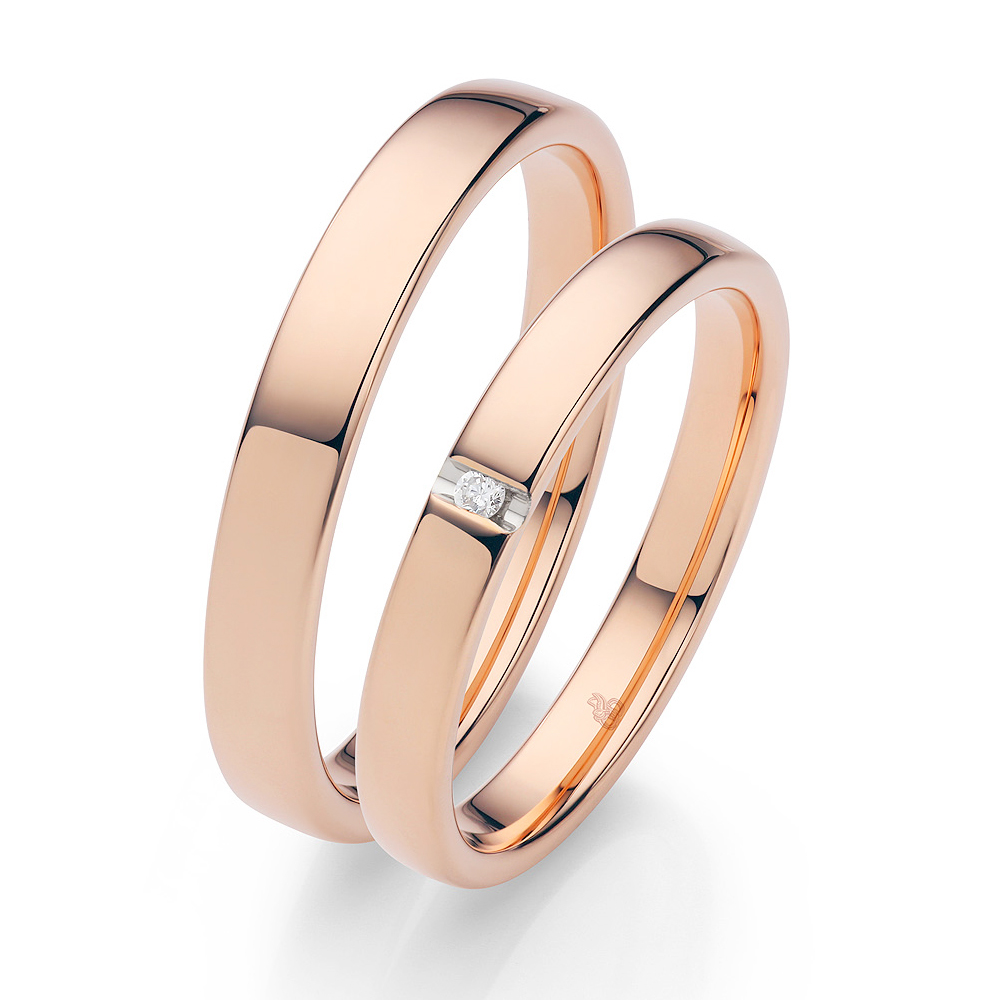 Rosegold Eheringe in poliertem Design und eingespanntem Diamanten