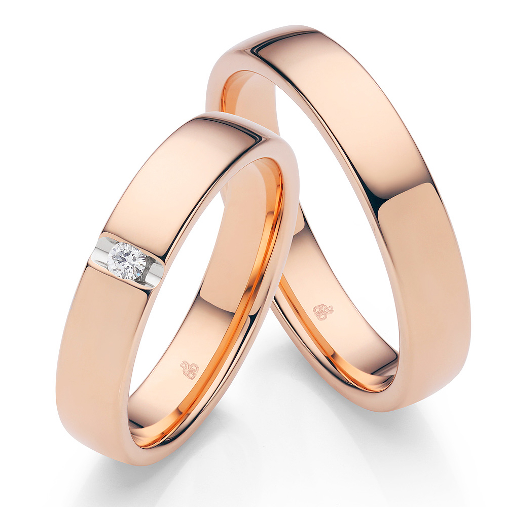 Roségold Ringe mit hochpolierter Oberfläche und einem Diamanten