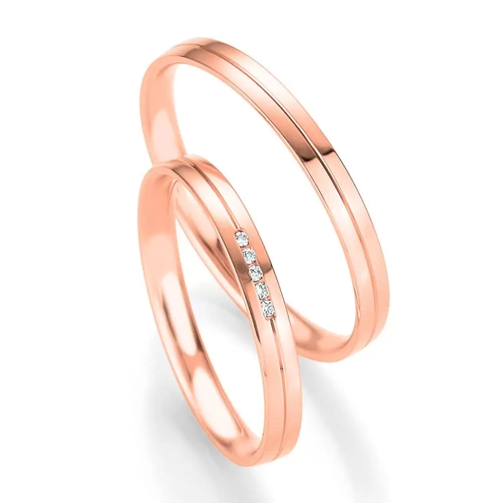Polierte Eheringe aus Rotgold mit 5 Diamanten in Kanalfassung