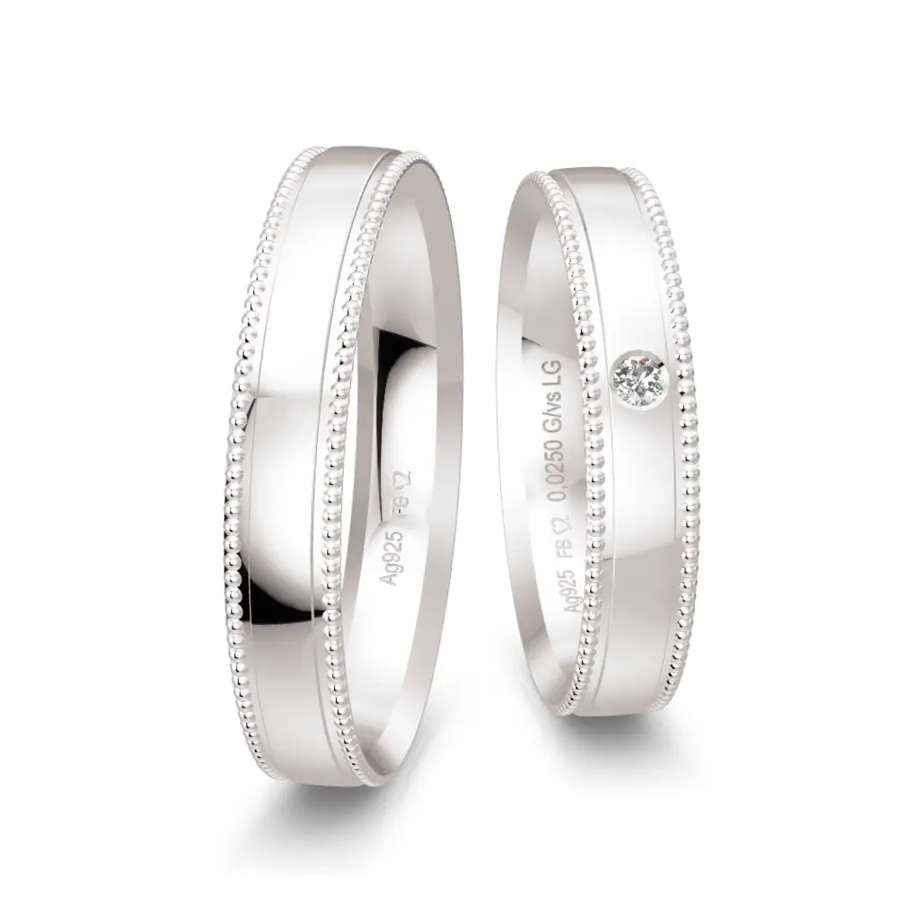 Eheringe aus Silber 925 mit Labor Diamanten und Millgriffmuster am Rand