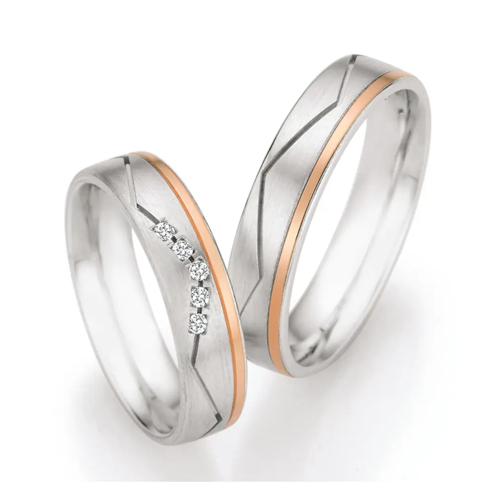 Silber & Rotgold Trauringe matt mit 5 Diamanten und Rille