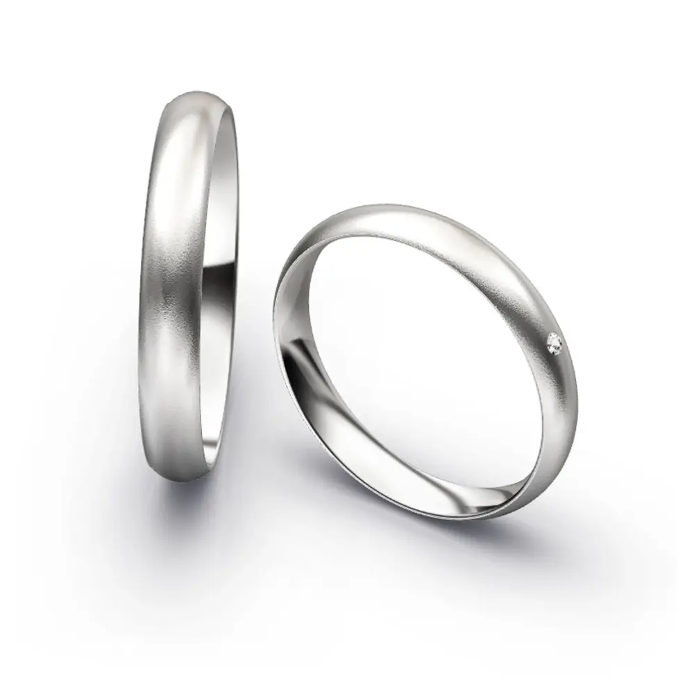 Aufnahme von schlichten sandmatten Trauringen aus Weissgold mit Diamanten mit 3,5 mm Breite 