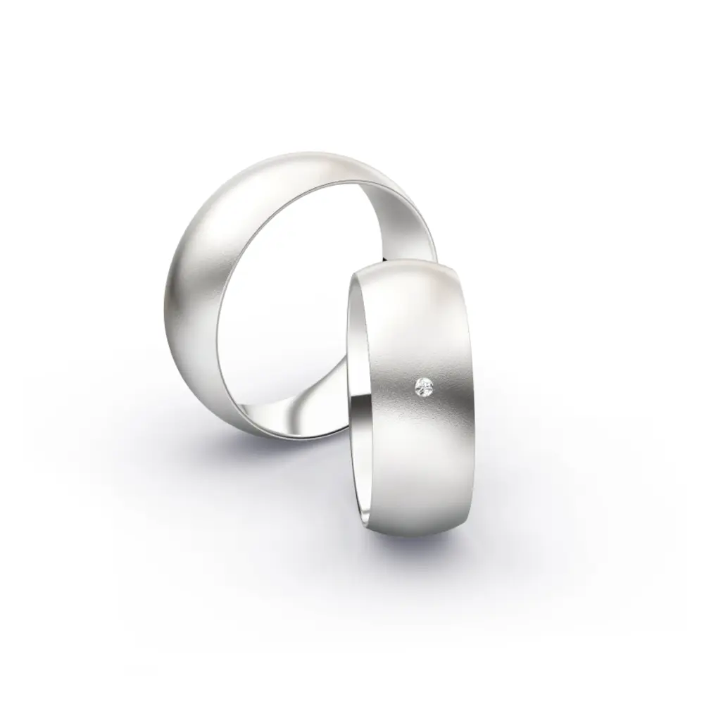 Weissgold Eheringe mit Diamanten und Sandmattierung in 7 mm Breite 