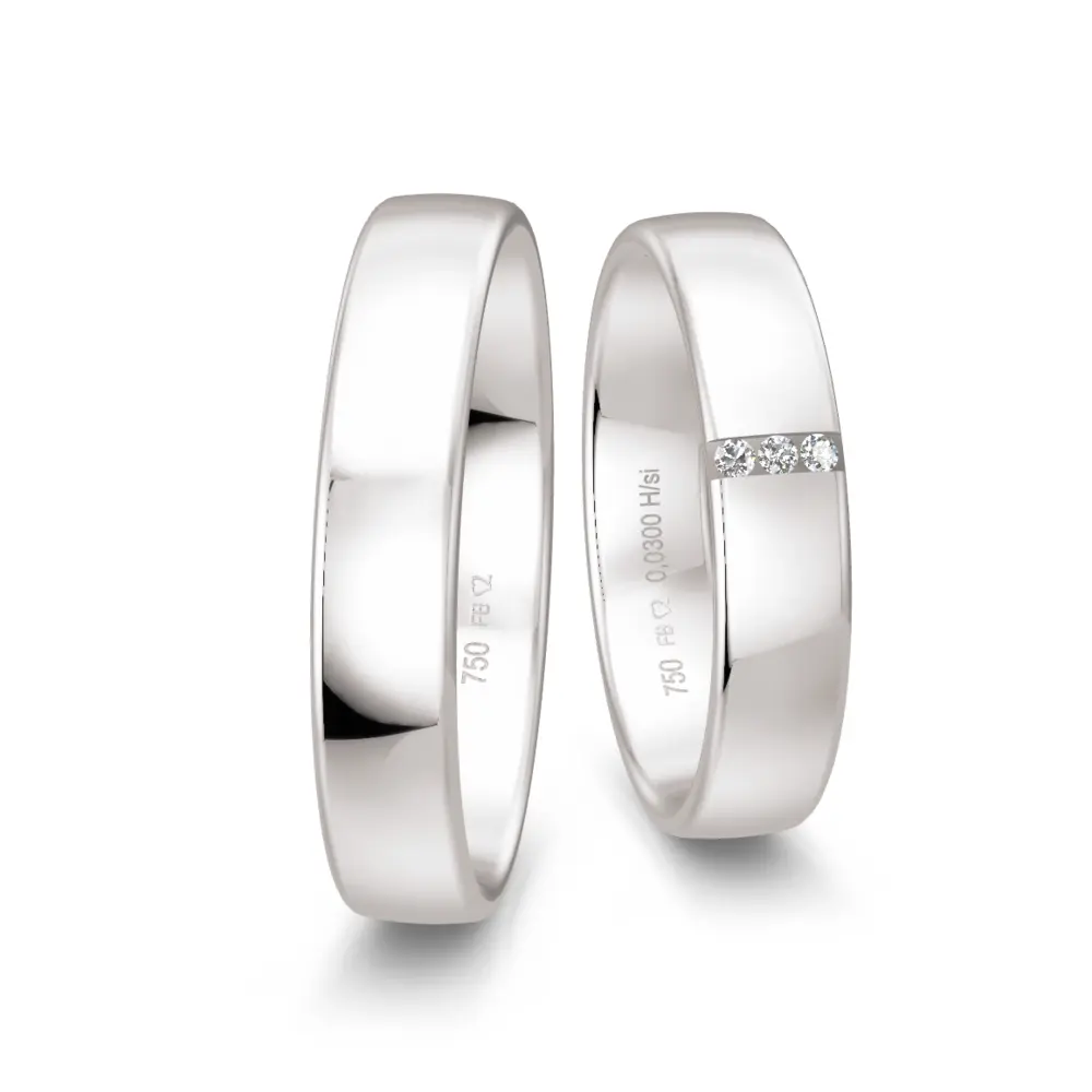 Mit Polierung veredelte Weißgold Eheringe mit drei Diamanten je 0,01 Karat