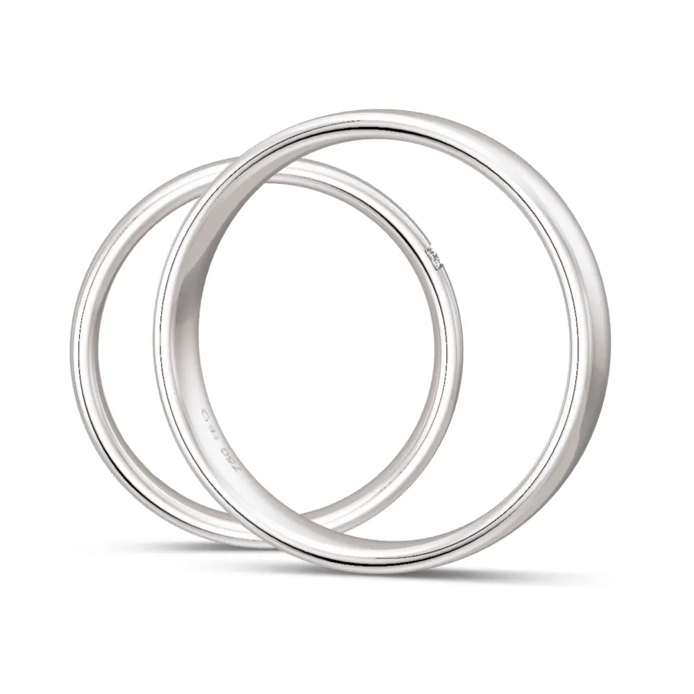 Mit Polierung veredelte Weißgold Eheringe mit drei Diamanten je 0,01 Karat seitlich