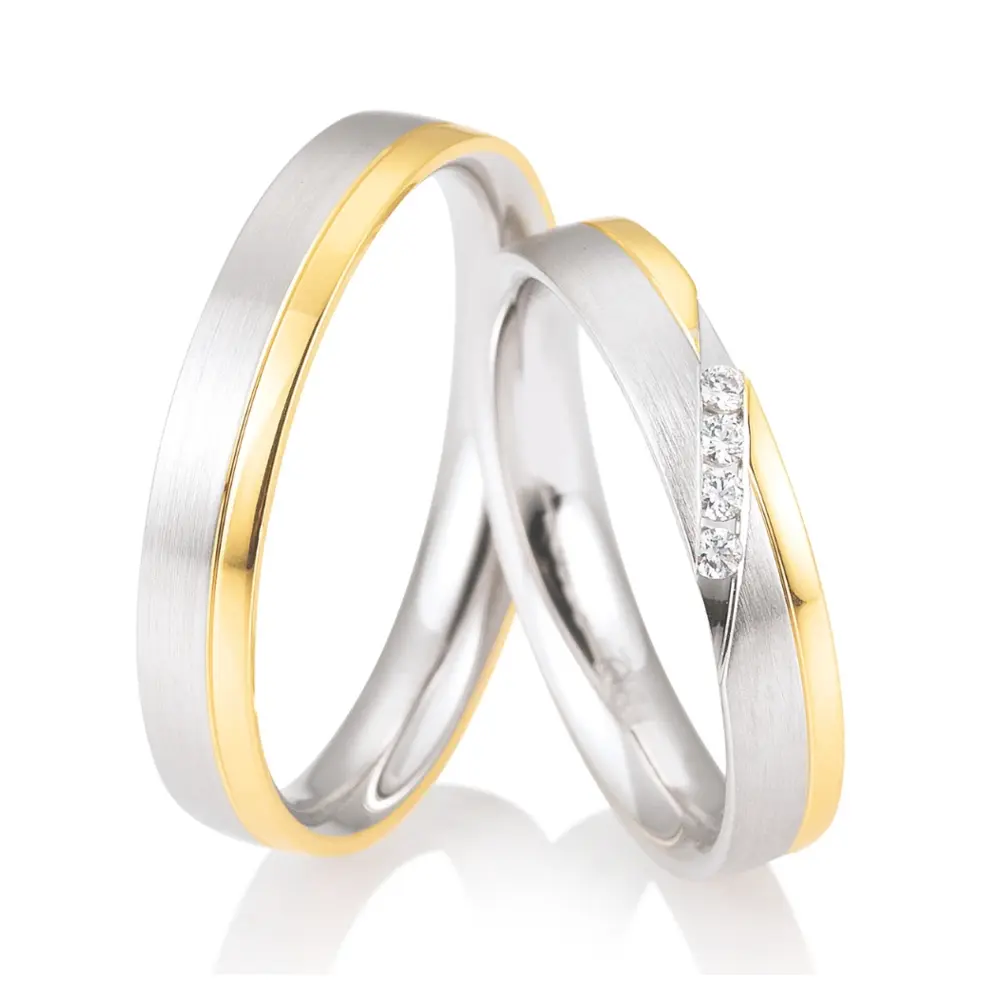 Bicolore Weiß&Gelbgold Eheringe mit 4 Diamanten mit je 0,02 Karat seitlich