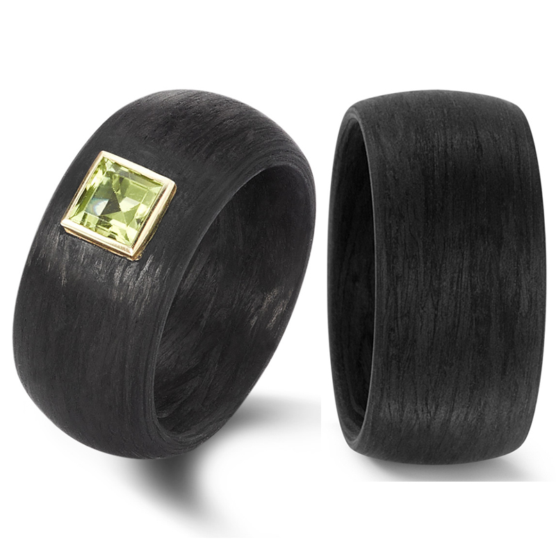 Einmalige Trauringe aus Carbon mit Peridot in Gelbgoldumrandung 8926930