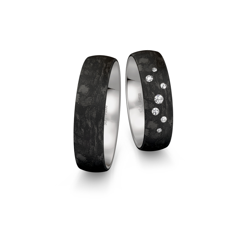 Aufnahme von Eheringen aus Palladium 500 und Carbon mit Diamanten und Sternenhimmel-Look