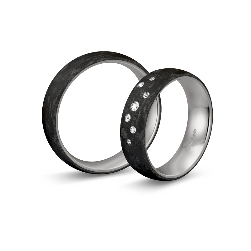 Aufnahme von Eheringen aus Palladium 500 und Carbon mit Diamanten und Sternenhimmel-Look