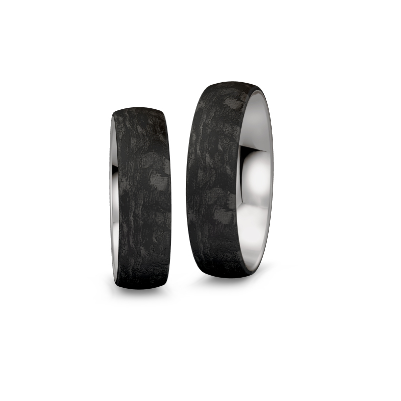 Aufnahme von Eheringen aus Palladium 500 und Carbon mit Diamanten und Sternenhimmel-Look