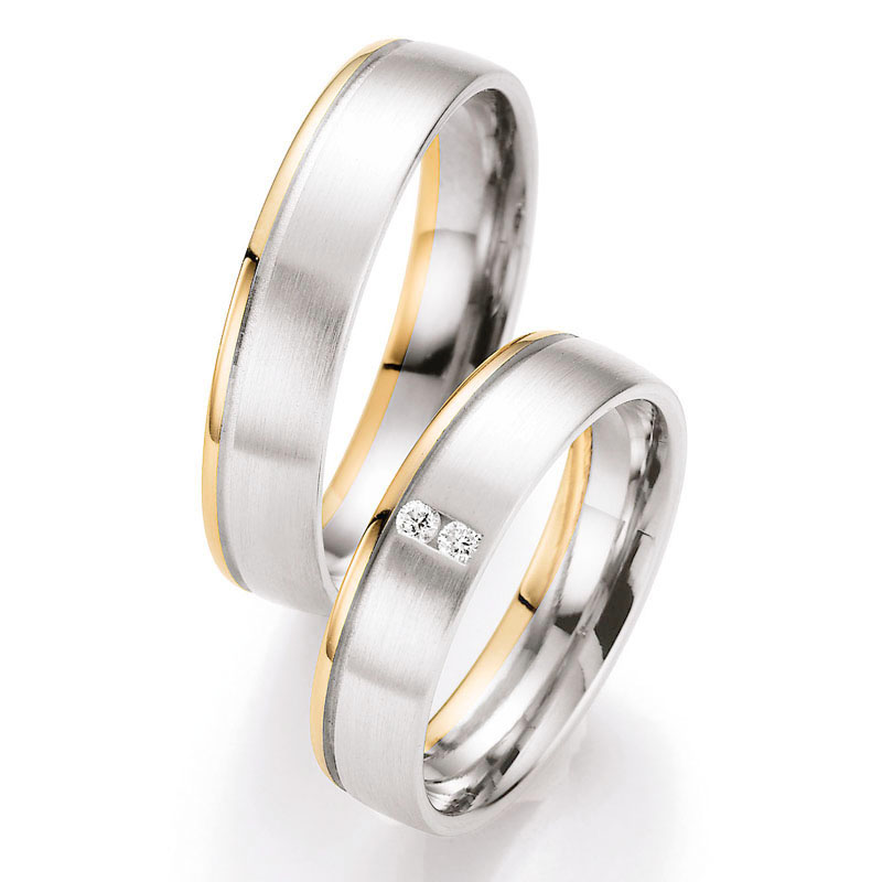 Aufnahme von Weißgold/Rotgold Eheringe mit Rille und 2 senkrecht gesetzten Steinen 