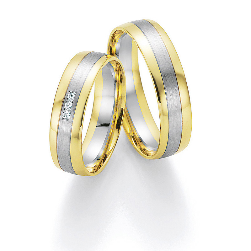 Aufnahme von Eheringen aus Palladium & Gelbgold mit Diamanten im bicoloren Design