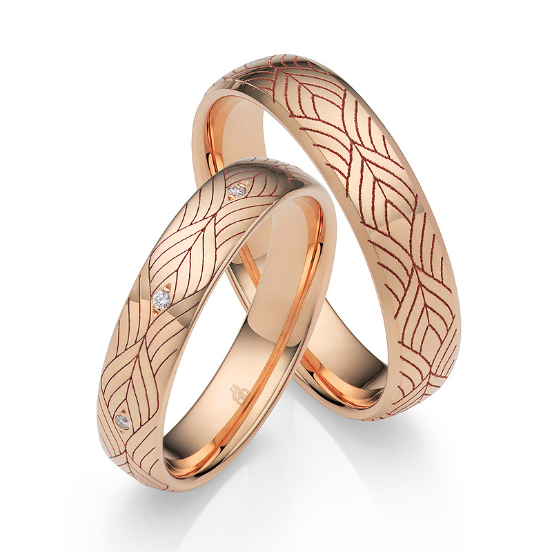 Roségold Eheringe mit Art Deco Design mit 8 Diamanten um Ringschiene