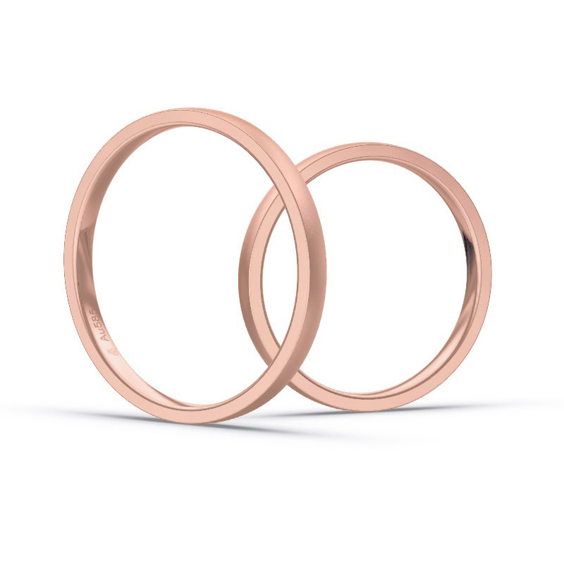 Aufnahme von schmalen Eheringen aus Rosegold in 2 mm Breite mit Diamant und Sandmattierung