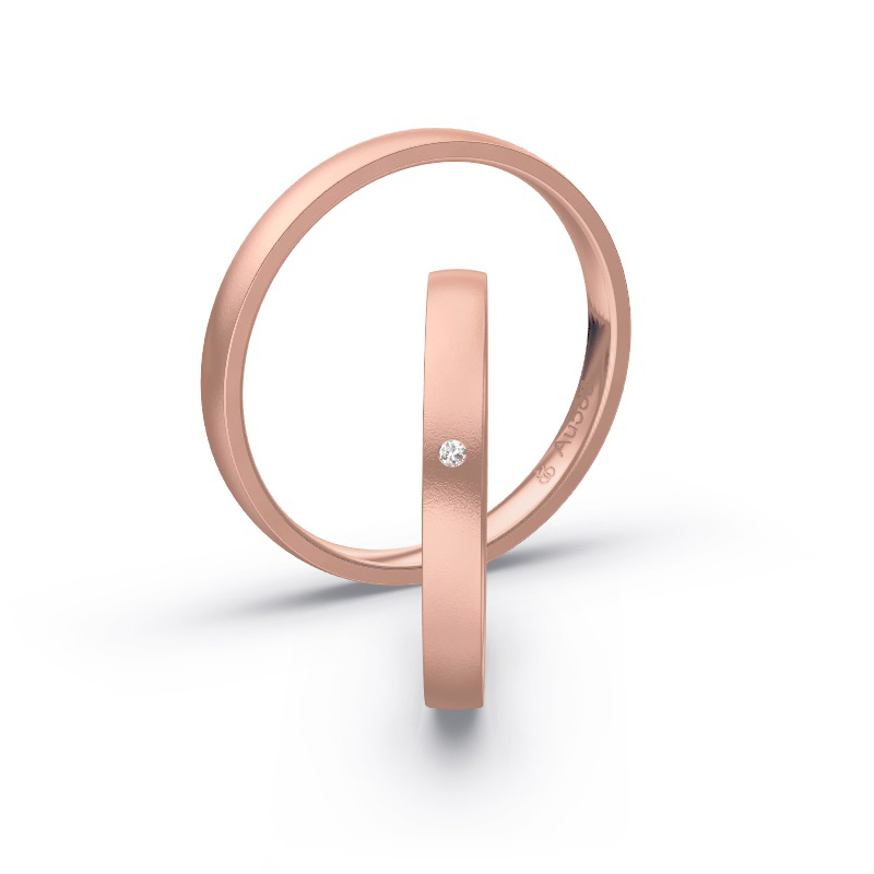 Aufnahme von schmalen Eheringen aus Rosegold in 2,5 mm Breite mit Diamant und Sandmattierung