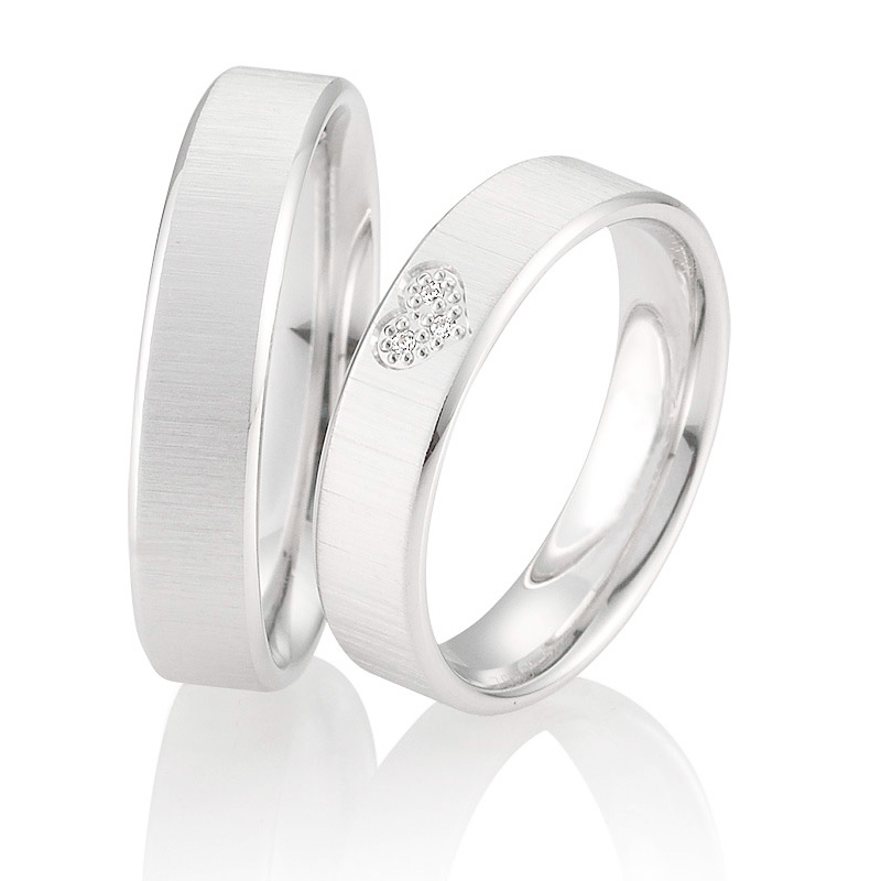 Eheringe aus Weißgold mit Diamanten in Herz designt