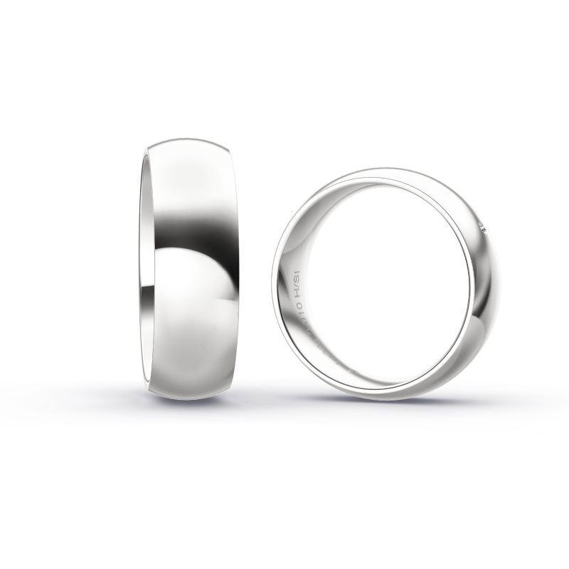 Polierte Eheringe aus Weissgold mit einem eleganten Diamanten in 7 mm Briete