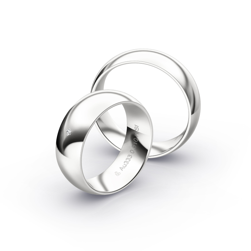 Polierte Eheringe aus Weissgold mit einem eleganten Diamanten in 7 mm Briete