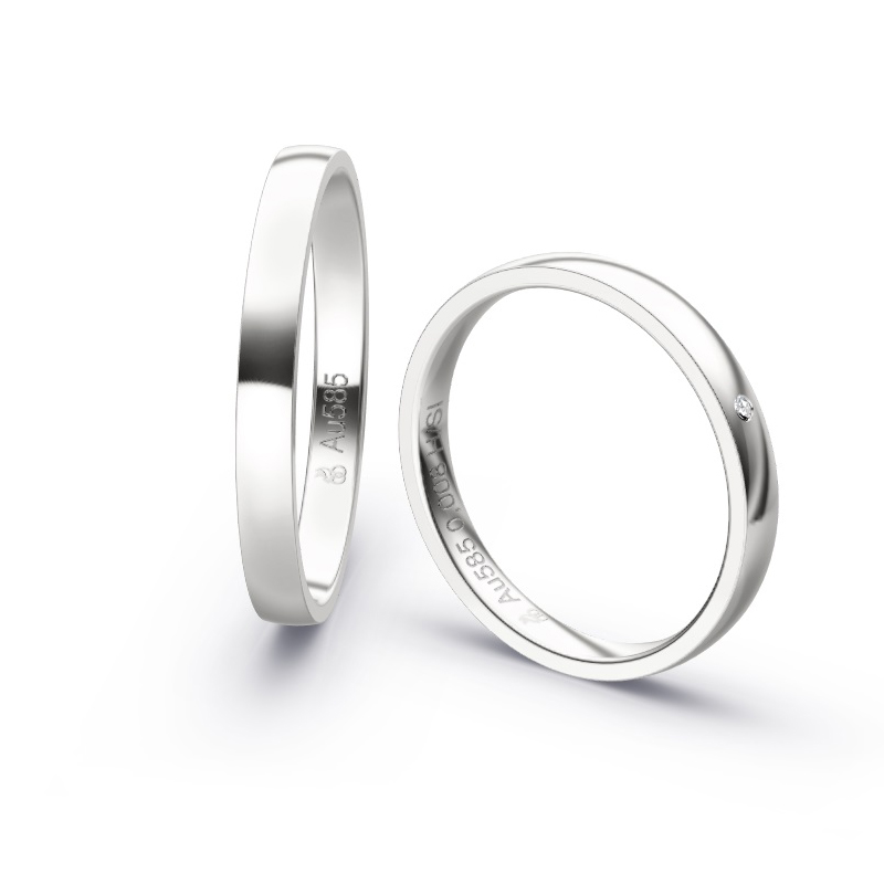 Aufnahme von schmalen Eheringen aus Weißgold in 2,5 mm Breite mit Diamant und Polierung 
