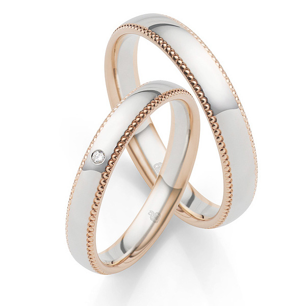 Bicolore Eheringe aus Weißgold und Roségold mit Diamanten