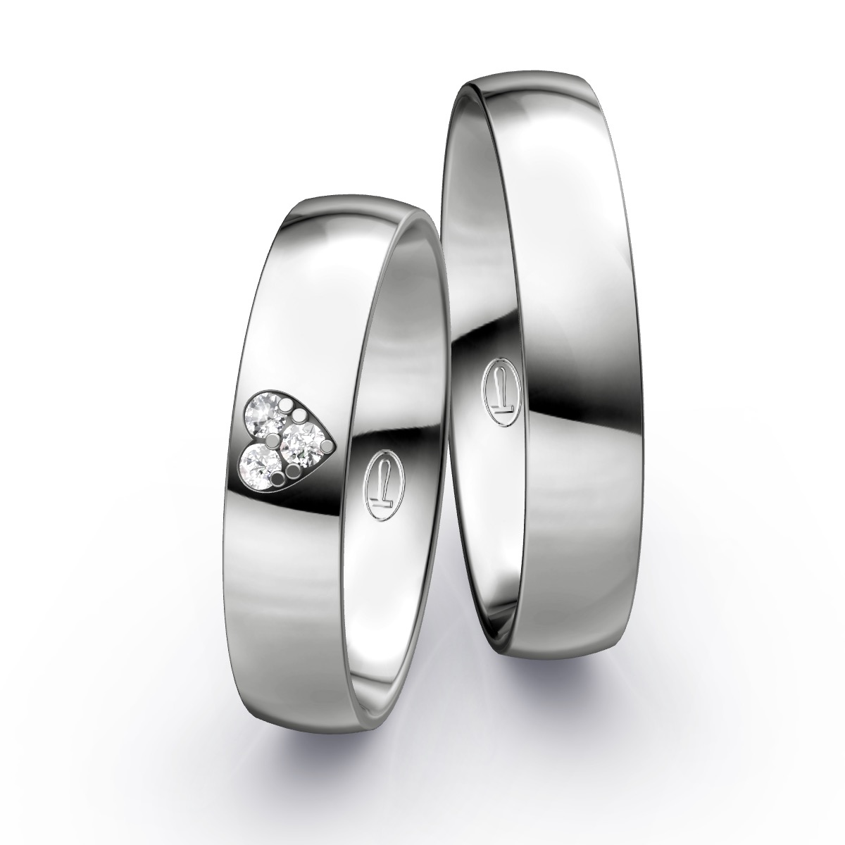 Polierte Eheringe aus Platin mit Herz aus Diamanten