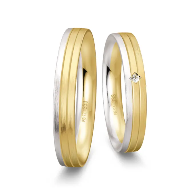 Trauringe aus Gelbgold und Weißgold schmal längsmatt mit Diamant