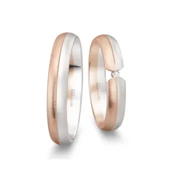Trauringe aus Weißgold und Roségold quergebürstet mit Diamant in Spannfassung