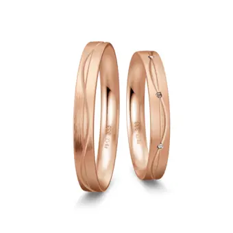Trauringen aus Roségold mit Mattierung und geschwungenen Rillen und Diamant