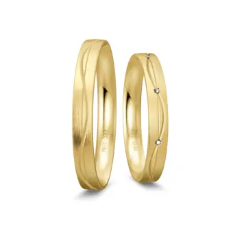Trauringe aus Gelbgold Mattierung mit geschwungenen Rillen und Diamant