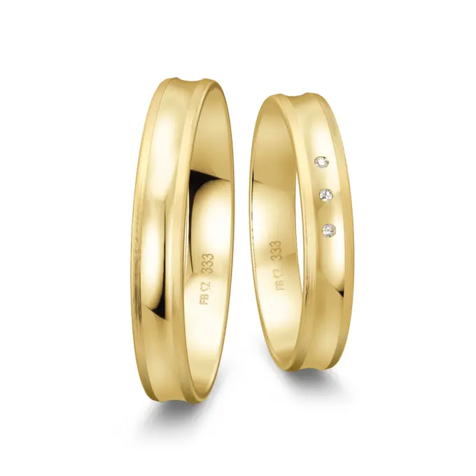 Trauringe aus Gelbgold poliert mit konkaver Form mit drei Diamanten