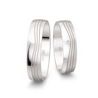 Weissgold Trauringe mit Diamant und welligem Rillenmuster