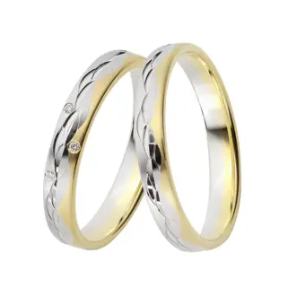 Gelbgold und Weissgold Eheringen mit Muster aus polierten Halbmonden und Diamant