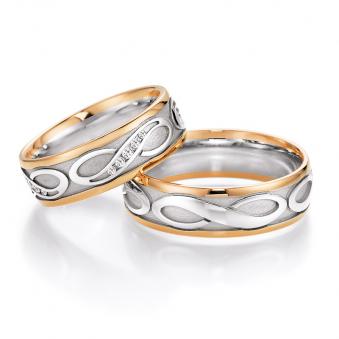 Aufnahme der Eheringe aus Weißgold und Rotgold mit Unendlichkeit-Zeichen und 20 Diamanten