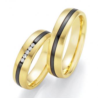 Aufnahme von Eheringen aus Gelbgold & Zirconium mit fünf Diamanten und geschwungenem Streifen 