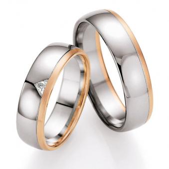Aufnahme von Palladium 500/Rosègold Eheringen mit mattem Rand und weißem Diamanten
