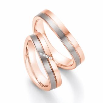 Aufnahme von Eheringen aus Rosègold & Palladium 500 bicolor längsmattiert mit vier Diamanten 