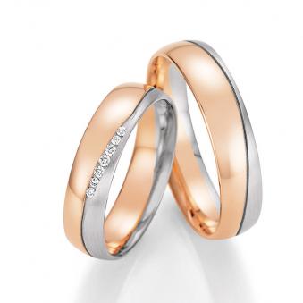 Aufnahme von Eheringen in Rotgold und Palladium 500 mit 7 Diamanten verschiedener Größe