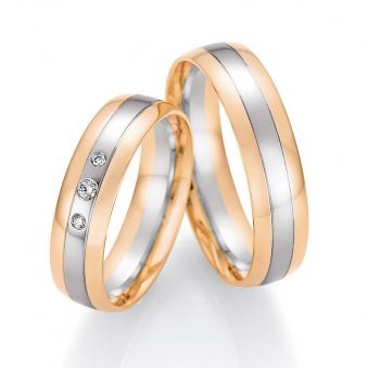 Aufnahme von Eheringen aus Palladium 500 & Roségold mit 3 mittig gesetzten Diamanten