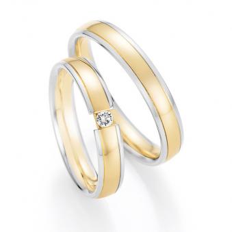 Aufnahme von Eheringen aus Weißgold und Gelbgold mit rundem Diamanten
