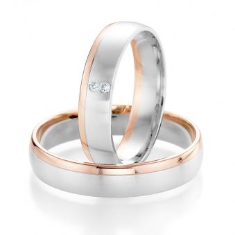 Aufnahme von Eheringen aus Weißgold & Roségold mit poliertem Rand und zwei weißen runden Diamanten