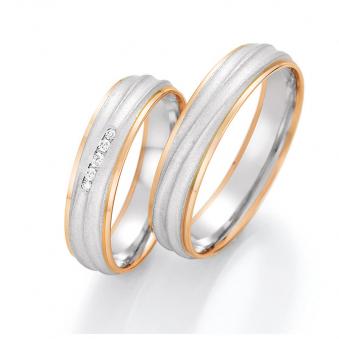 Aufnahme von Eheringen aus Weißgold/Rotgold mit fünf Diamanten und welliger Strukturierung