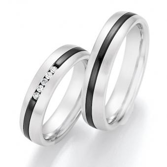 Aufnahme von Eheringen aus Weißgold mit schrägem Zirconiumstreifen und fünf weißen Diamanten 