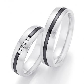 Aufnahme von Eheringen aus Weißgold & Zirconium mit schwarzem schrägem Streifen und fünf Diamanten 