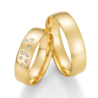 Trauringe aus Gelbgold mit 8 unterschiedlich großen Diamanten mit insgesamt 0.065 Karat 