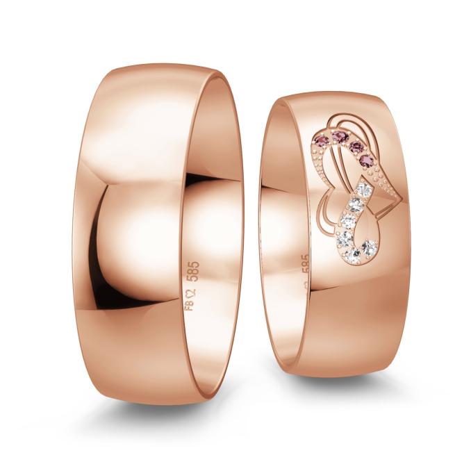 Eheringe in Roségold mit Diamanten in rot und weiß als Herzmuster