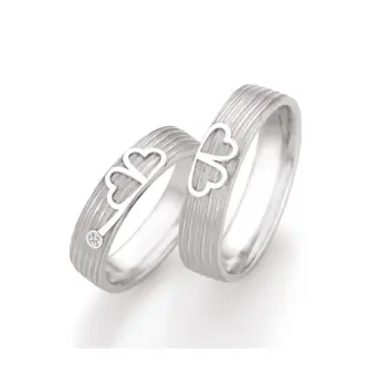 Eheringe aus 925er Silber mit ringübergreifendem Kleeblatt und Diamant
