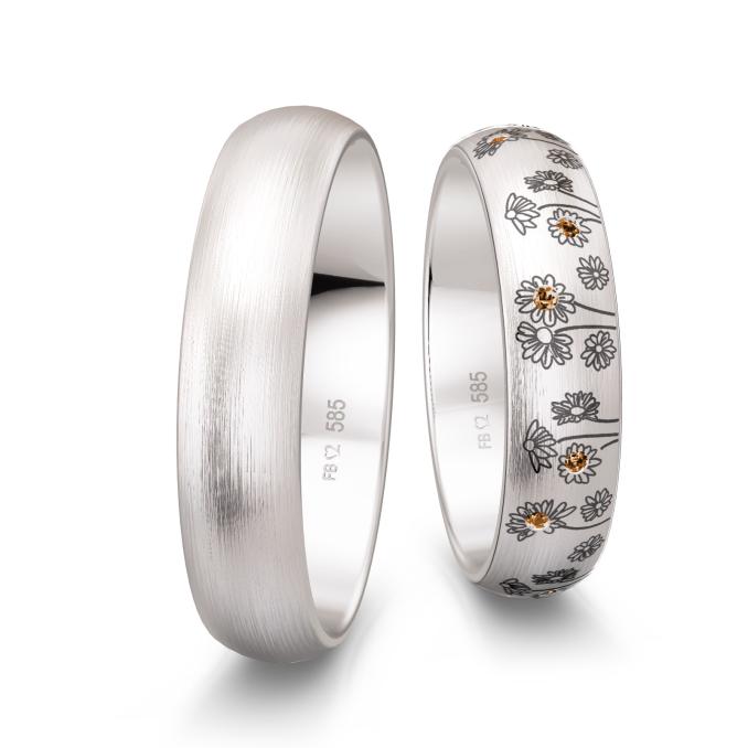 Weißgold Trauringe mit Blumenmuster als Dekor und vierzehn Diamanten