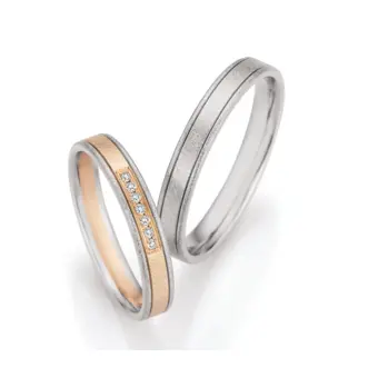 Eismattierte Palladium 500 und Champagne Gold Eheringe mit 7 Diamanten