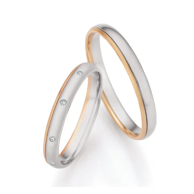 Palladium 500 und Champagne Gold Eheringe mit 9 Diamanten mattiert