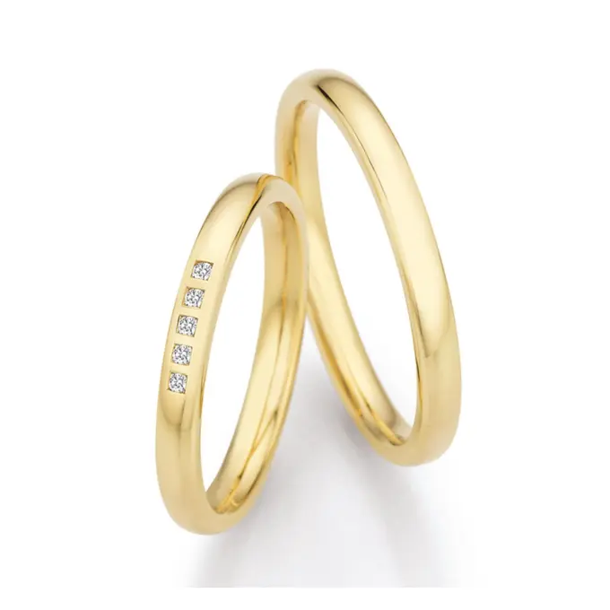 Schmale polierte Gelbold Eheringe mit 5 Diamanten einzeln gefasst